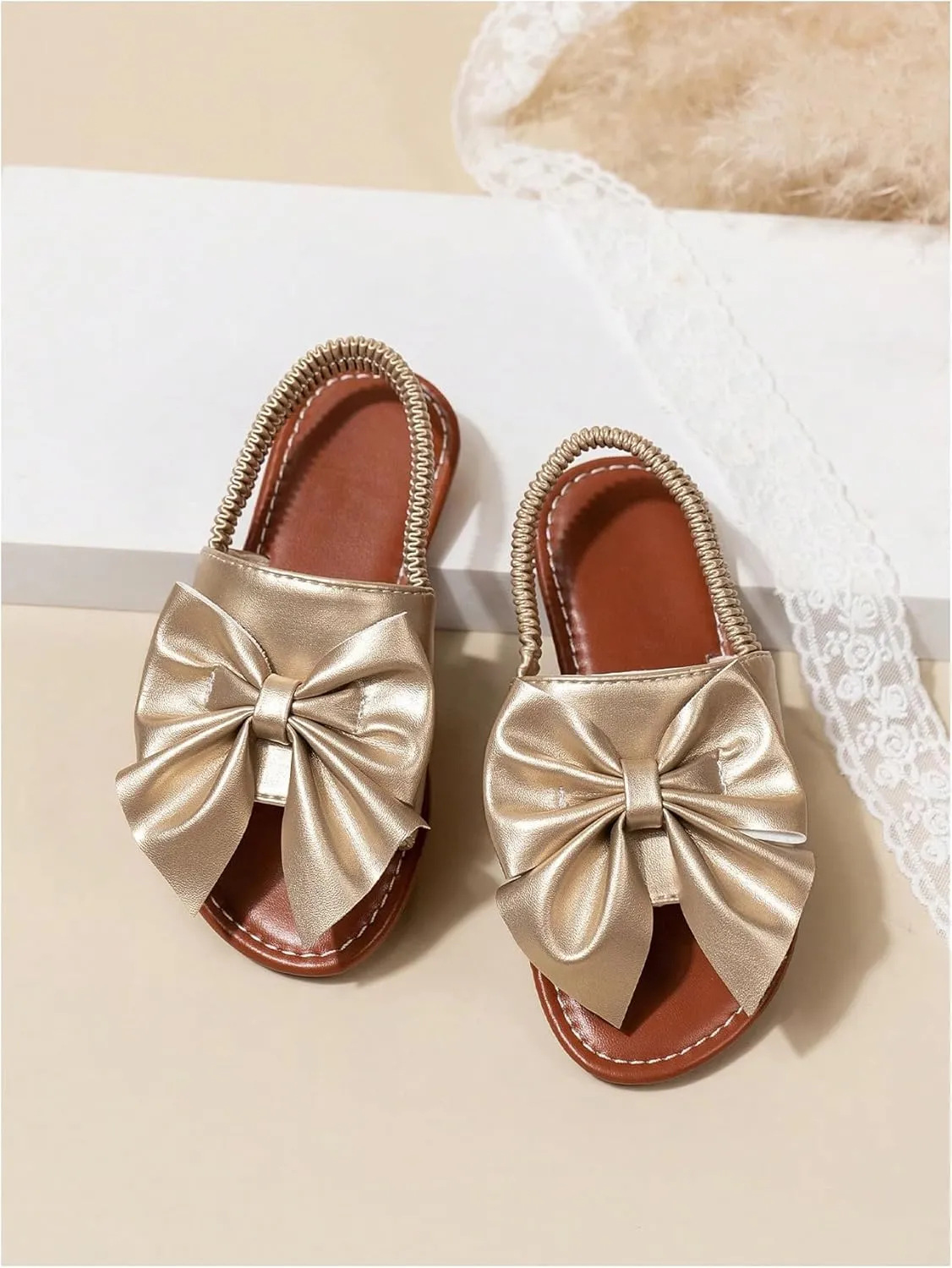GORGLITTER Girl's Gold Bow Tie Flat Sandals Metallic Open Toe Ankle Strap Cute Slide Sandals Vacation Shoes