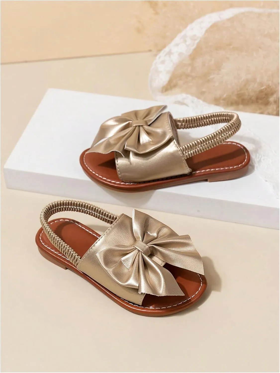 GORGLITTER Girl's Gold Bow Tie Flat Sandals Metallic Open Toe Ankle Strap Cute Slide Sandals Vacation Shoes