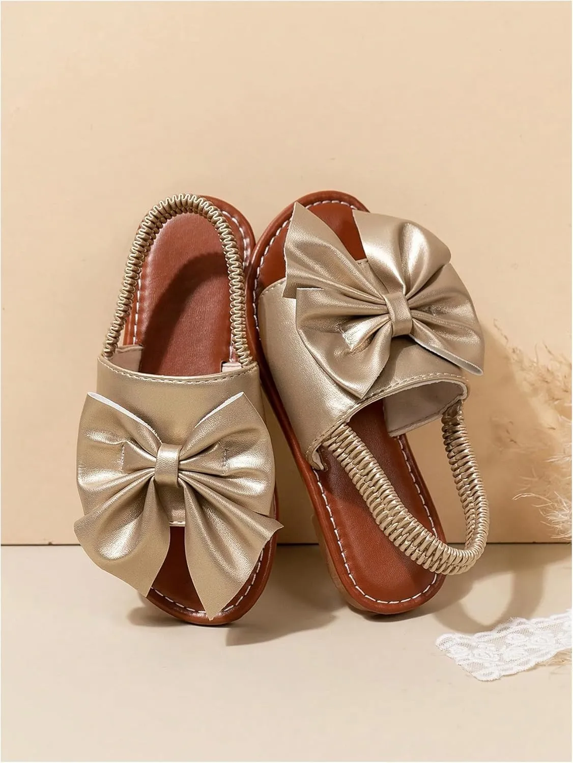 GORGLITTER Girl's Gold Bow Tie Flat Sandals Metallic Open Toe Ankle Strap Cute Slide Sandals Vacation Shoes
