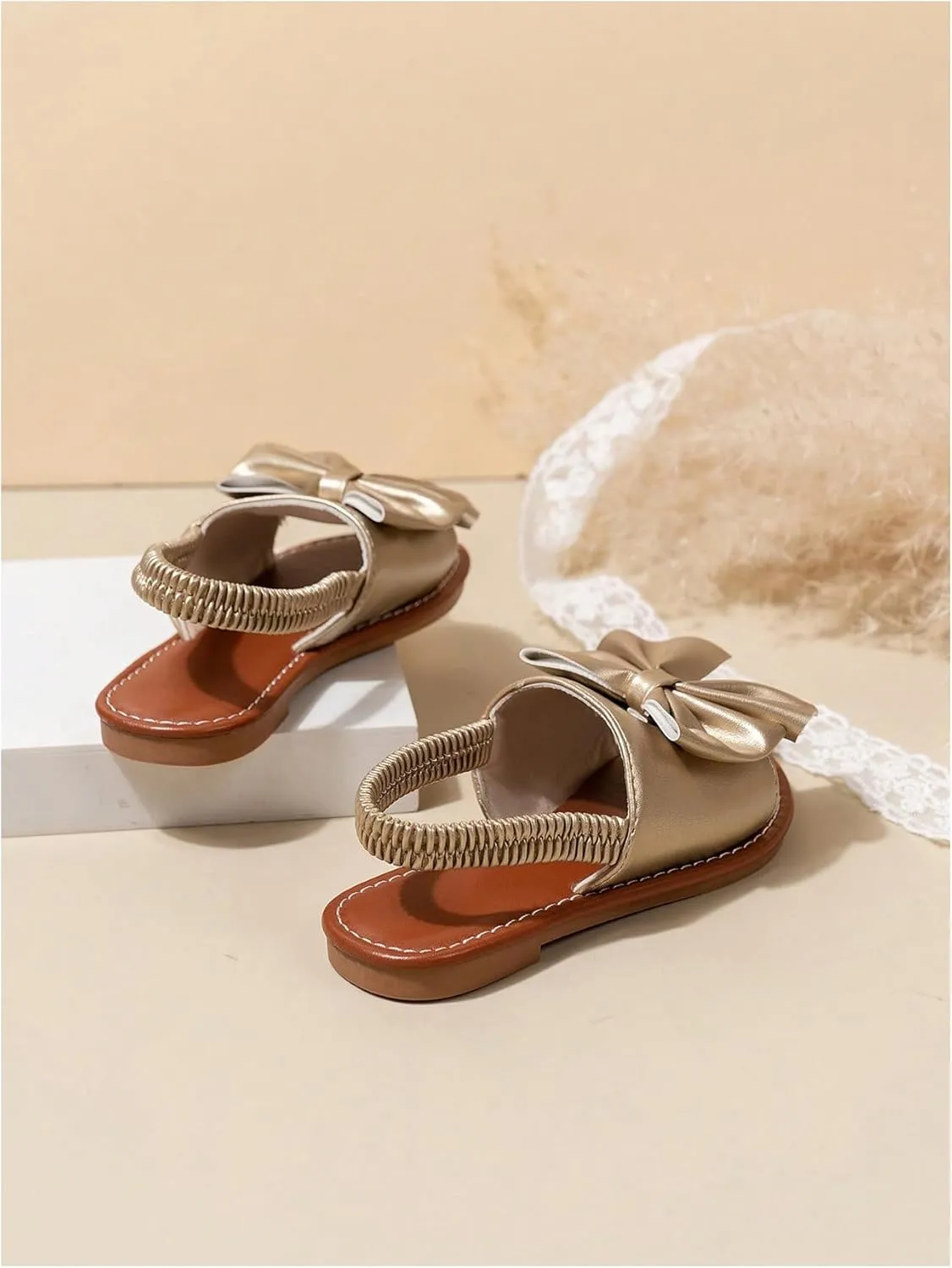 GORGLITTER Girl's Gold Bow Tie Flat Sandals Metallic Open Toe Ankle Strap Cute Slide Sandals Vacation Shoes